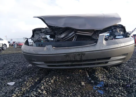 1999 Toyota Camry Le z USA, uszkodzony, nr VIN JT2BG22K6X0308775